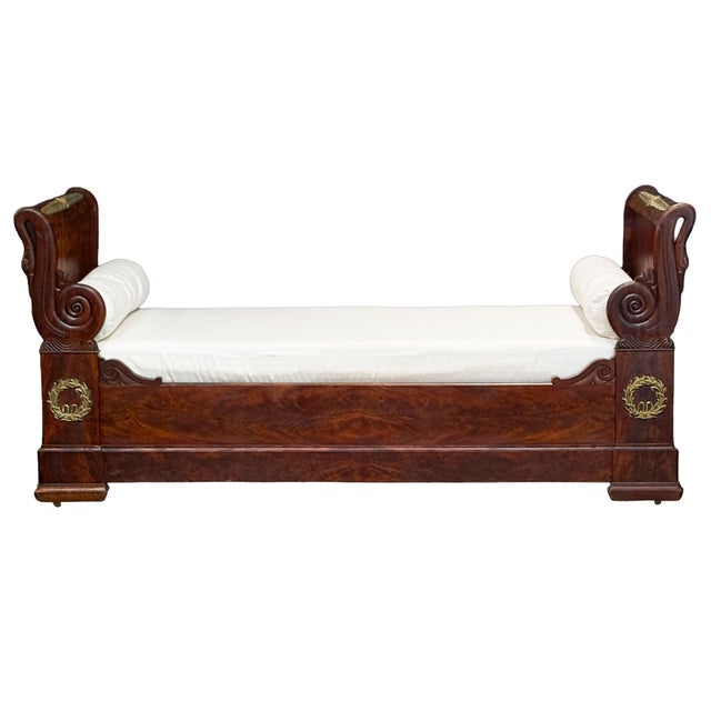 A fine French Empire daybed - historically referred to as a lit en bateau (boat or sleigh bed) due to its iconic curved...