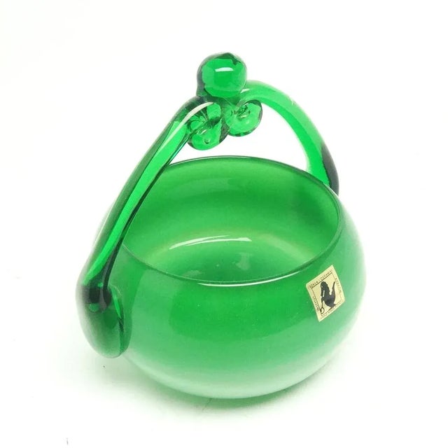 Manufacturing defect between the stand and the bowl in the middle of glass. This piece has an attribution mark, I am sure...