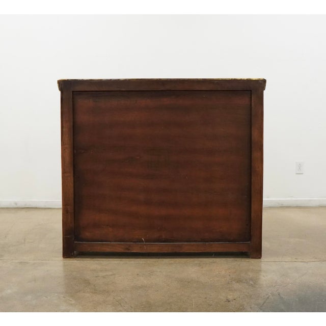 This sideboard blends reclaimed wood construction with a dark metal-clad top, creating a sophisticated balance of warmth,...