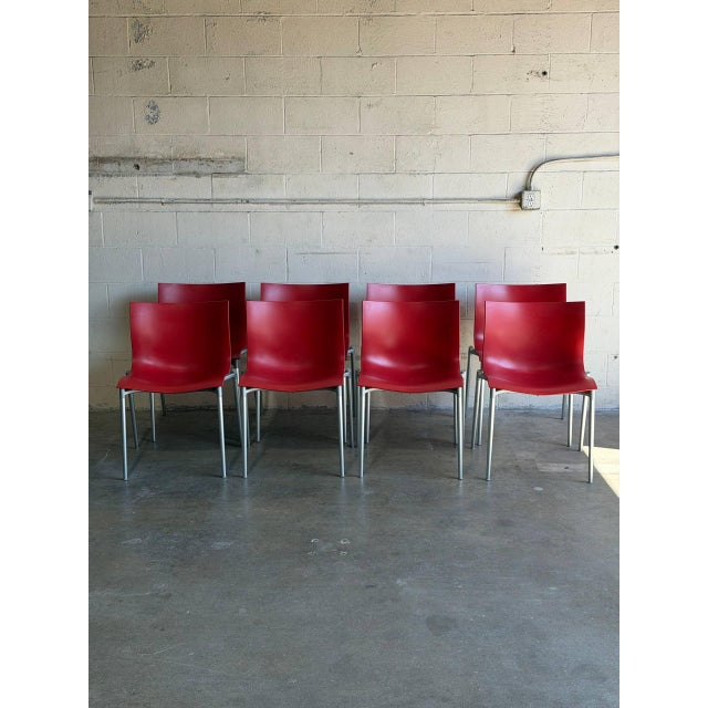 This set of 8 stacking chairs features contoured seats and sleek space-saving functionality. Vintage 1990s. Designed by...