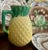 Charming antique majolica pineapple pitcher with pink interior.A delightful antique majolica pitcher modeled as a...