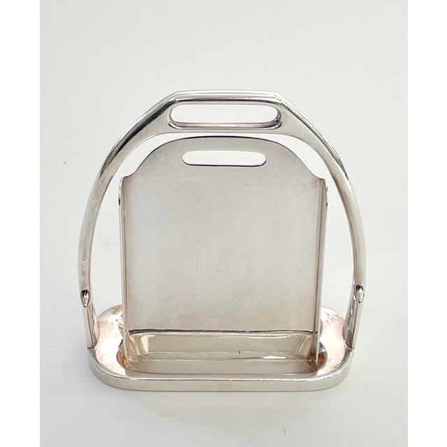 In the shape of a stirrup, this frame or card holder was made by Hermès in the 1970s. It is stamped “Hermès Paris Made in...