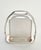 In the shape of a stirrup, this frame or card holder was made by Hermès in the 1970s. It is stamped “Hermès Paris Made in...
