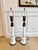 Striking pair of monumental vintage table lamps crafted from molded white milk glass with beautifully aged brass-tone...