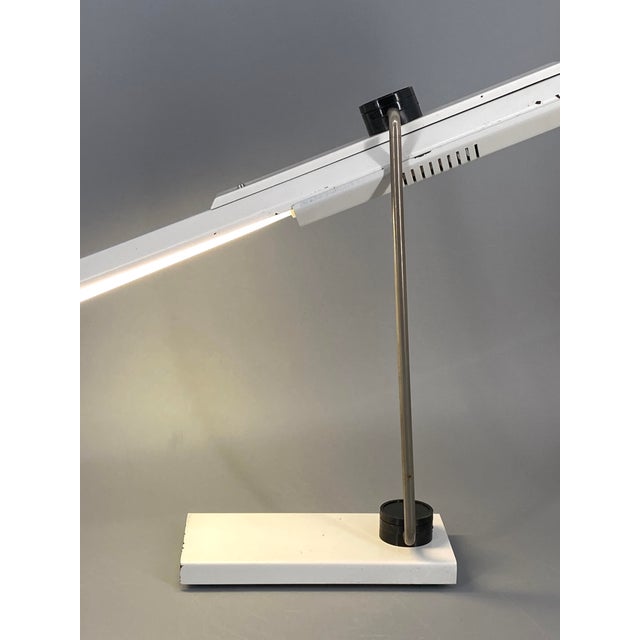 A table lamp * manufacturer: veb tafelgeräte dessau * designed by gerd laitko around 1986 * winner of the 1988 gdr design...