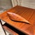 AMBIANIC presents 1970s Tropical Mahogany Sculptural Wood Tray 15.5 long x 5.13 w x .88 h Stamp faded appears as Haiti...
