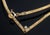 This elegant Italian-crafted in Vicenza, Italy. The necklace showcases a lustrous 14k gold herringbone chain designed with...