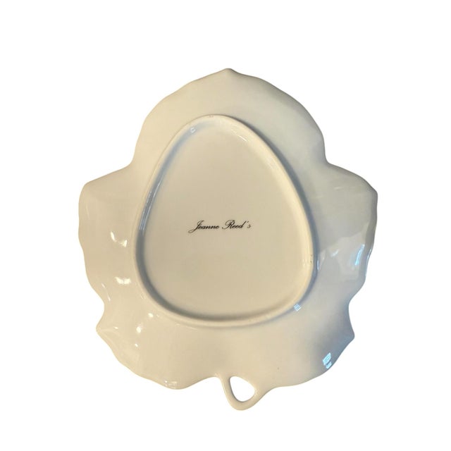 Jeanne Reed's Blue and White Painted Leaf Plate This plate features a simple chinoiserie scene with a delicate border.