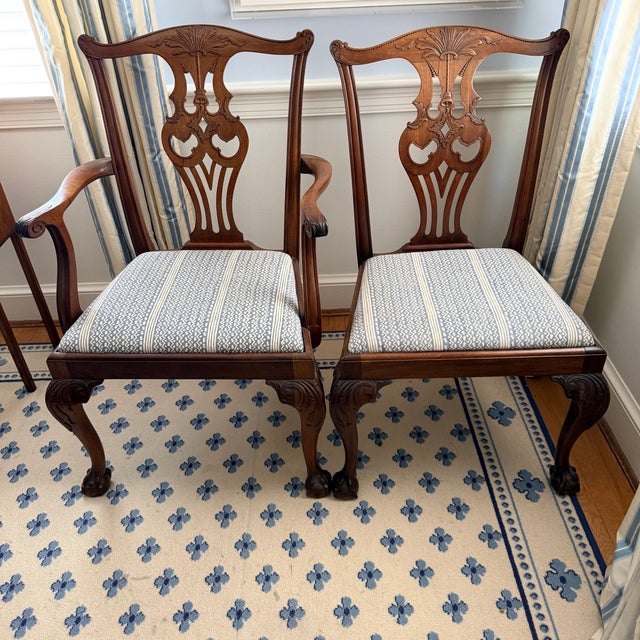 Set of 8 Antique Chippendale Chairs with Fortuny Upholstery A beautiful antique set with intricately carved backsplats...