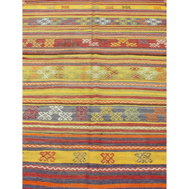Mid 20th Century Vintage Turkish Kilim Rug in Yellow, Red, Green, and Blue With Tribal Motifs For Sale - Image 5 of 13