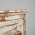This 19th Century French wooden buffet features a striking white patinated finish with layers of wear that reveal the warm...