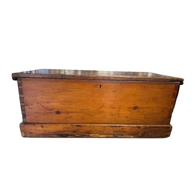 A wonderful 19th-century hand-crafted pine blanket chest featuring beautiful hand-cut dovetail joinery, original rope side...