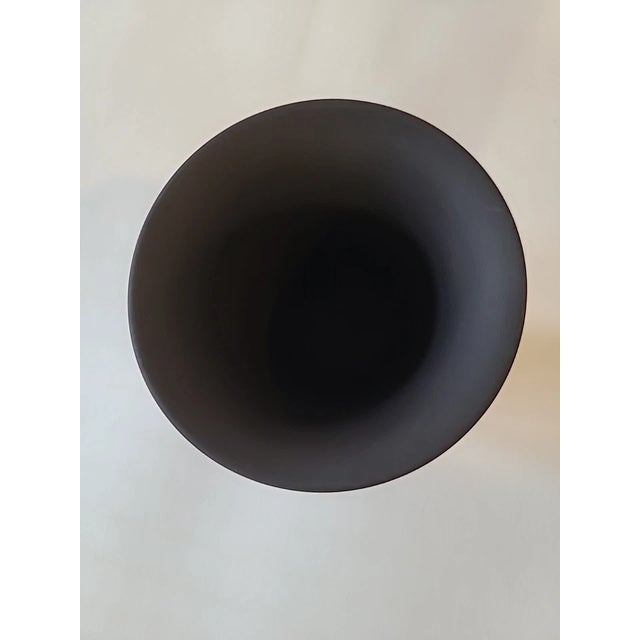 Add timeless neoclassical elegance to your collection with this Vintage Wedgwood Black Jasperware Footed Vase. Crafted in...