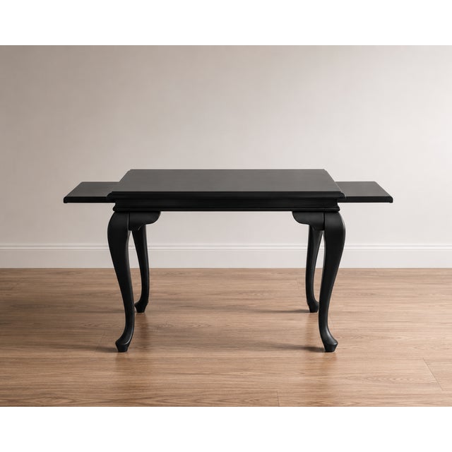 Timeless elegance meets modern sophistication with this beautifully refinished vintage Queen Anne drop-leaf dining table....