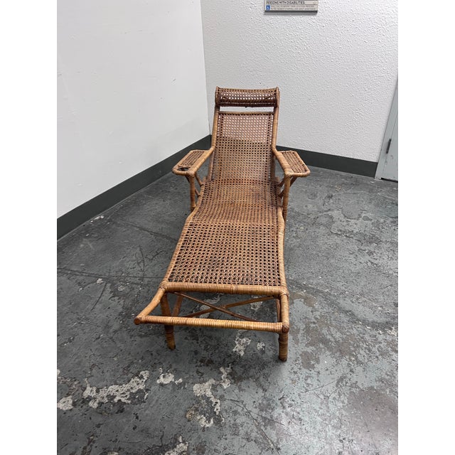 Design Plus Gallery presents an Antique Chinese Bamboo Reclining Chair from the 1920s. This vintage chaise lounge...