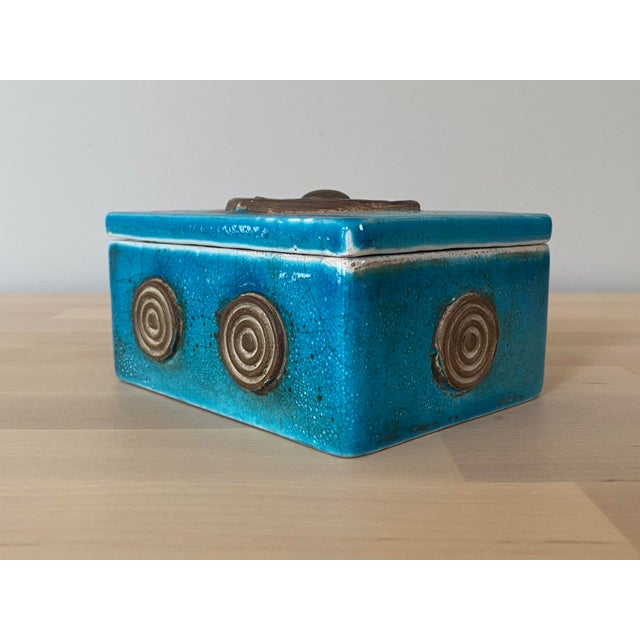 A wonderful midcentury pottery box by Ugo Zaccagnini featuring a dynamic applied bullseye motif on the top and sides. The...