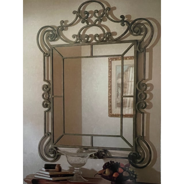 Check out the gorgeous mirror with hand forged iron scrolling by Ethan Allen- this beautiful piece offers a sense of...