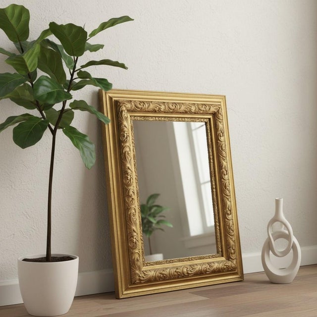 Elegant antique gilt mirror with richly carved scrolling acanthus ornament, likely American or European, circa 1890–1910....