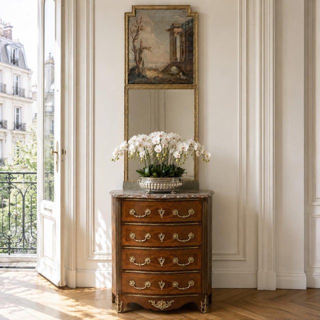 A refined early 19th century French trumeau mirror from the Directoire period, beautifully composed with the restrained...