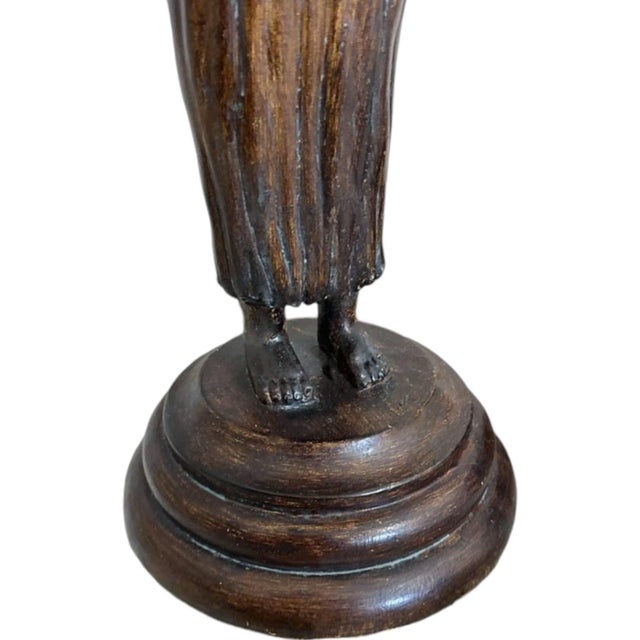 Glamorous polychrome sculptural table lamps featuring two separate women each holding an orb/sphere with both hands. They...