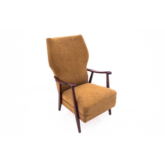 Yellow Mid-Century modern armchair. Made in Denmark in the 1960s. It has undergone a thorough renovation in our studio and...