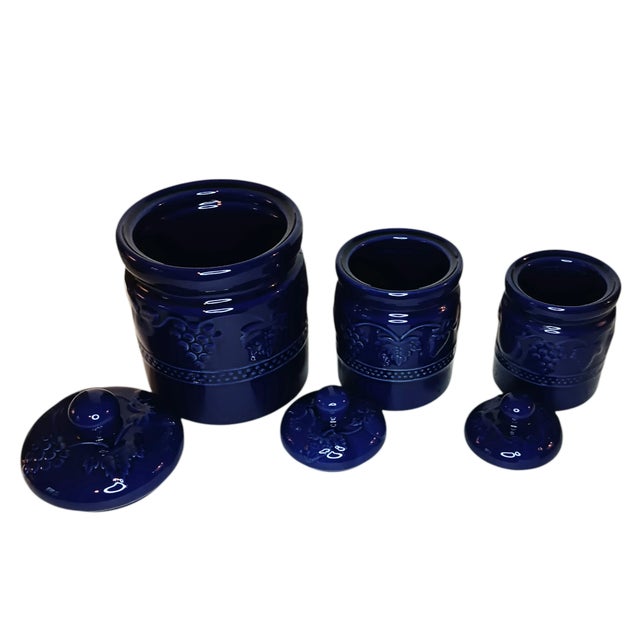 3 Vintage Cobalt Blue Ceramic Canisters Canister Set Raised Fruit Design This vintage cobalt blue ceramic canister set...