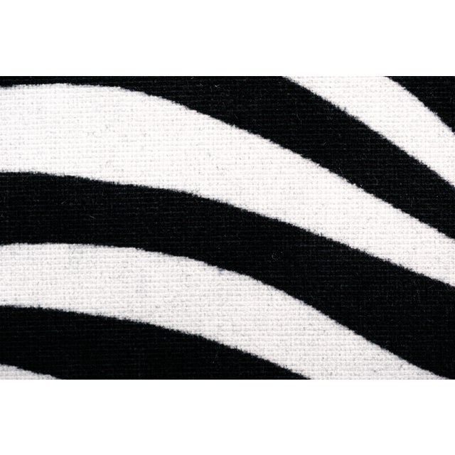 A set of four Danish modern teak dining chairs from the 1960s, newly reupholstered in a bold black and white zebra print...