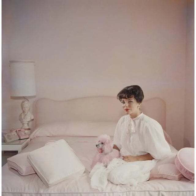 Slim Aarons, Pink Accessory, Estate Stamped Photographic Print, 1955 / 2020s For Sale