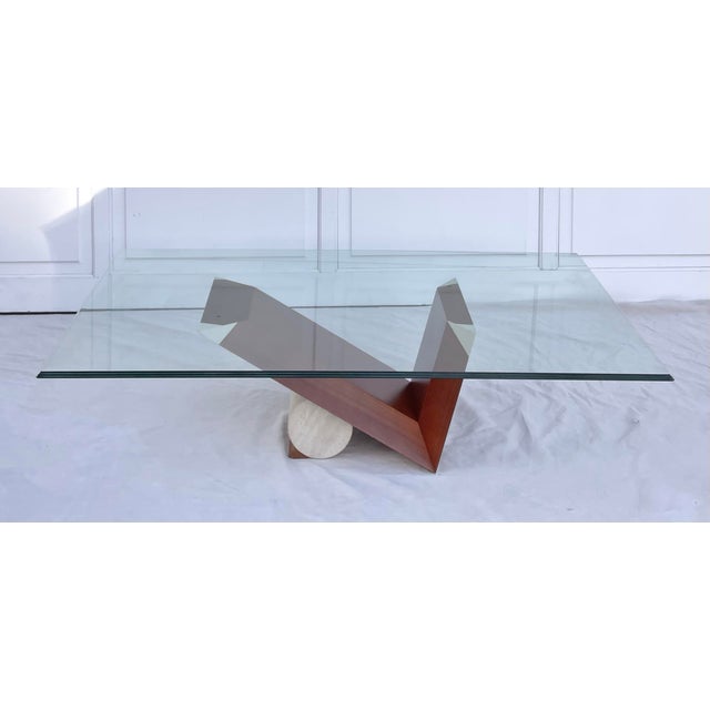 This sculptural Italian modern coffee table is attributed to Emanuele Zenere for Cattelan Italia and reflects the...