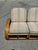 A restored, 1950s rattan 3-seater sofa that has been recently refinished and reupholstered in the fabric and welting...