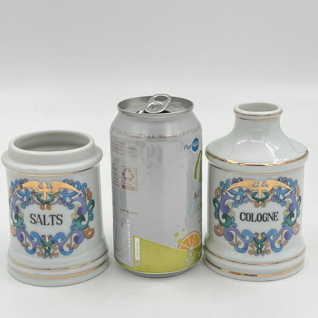 Beautiful set of two antique French ceramic apothecary jars, hand-painted blue and green design with striking gold trim....