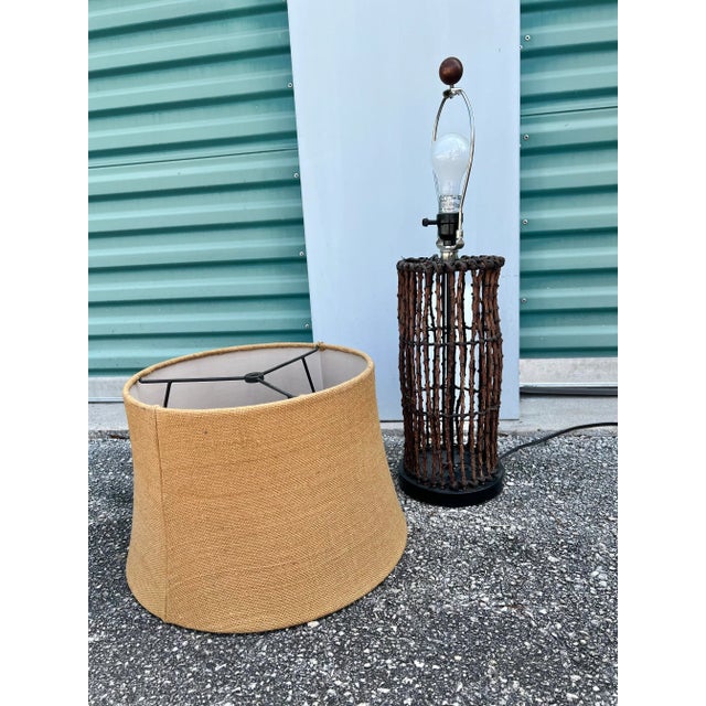 Vintage natural wood branches lamp with shade. Natural wood twigs Woven to Black Metal cylinder shaped Frame. The base is...