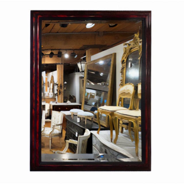 This modern ebonized mirror is reflective of the 19th century Flemish style cushion mirrors. The ripple carving gives...