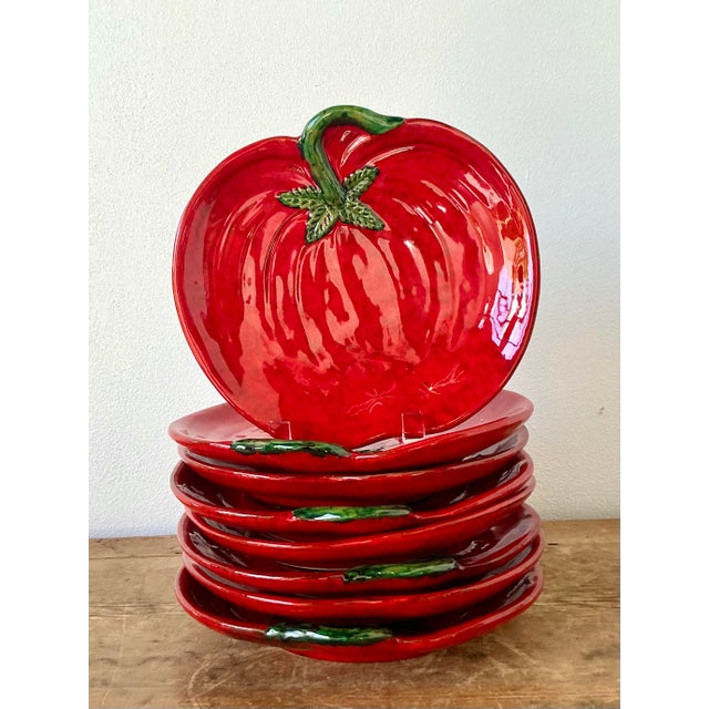 This charming set of eight vintage Italian majolica plates is a delightful celebration of mid-century trompe l’oeil...