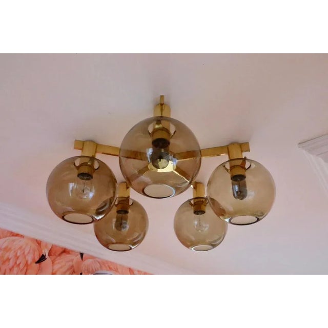 Flushmount. Produced by Hans-Agne Jakobsson AB in Markaryd, Sweden, 1960s. Frame in polished brass. Blown original glass....