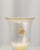 Decorative vase with a wide, goblet-shaped mouth, made using the traditional glassblowing technique. The translucent glass...