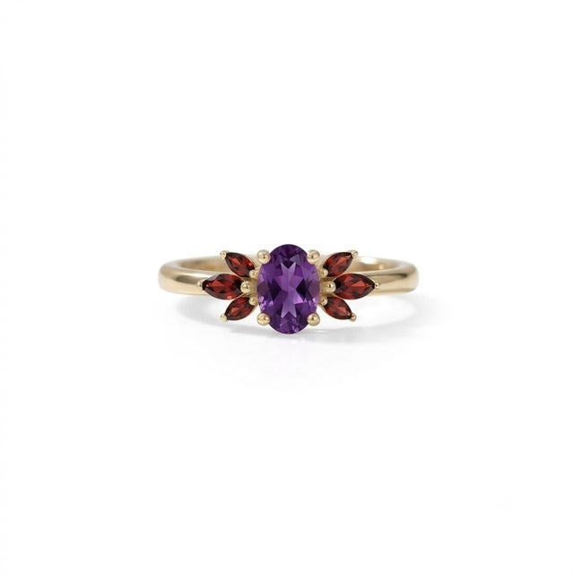 Embrace vibrant color and striking design with this beautifully crafted Oval Amethyst and Garnet Cluster Ring. At its...