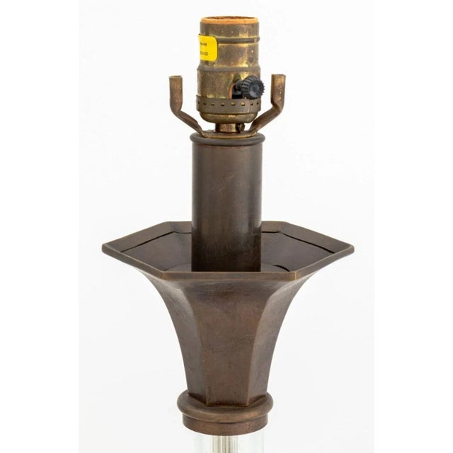 Pair of Chapman Art Deco Style Brass and Glass Table Lamps, 1985, with cylinder glass column on brass shell form tripod...