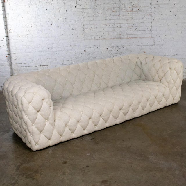 Magnificent vintage Modern Chesterfield style sofa composed of a beige twill upholstery with an all over diamond tuck...