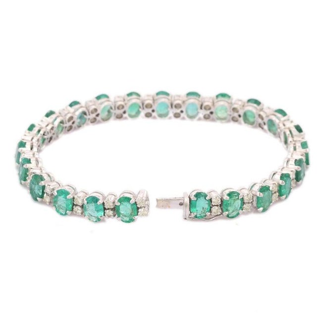 This is part of Chairish’s Fine Jewelry assortment. This Handcrafted Natural Emerald Diamond Tennis Bracelet in 14K gold...