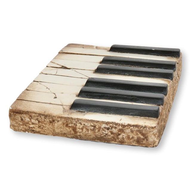 A pair of highly collectible Sid Dickens Memory Blocks celebrating music and craftsmanship. One depicts a vintage piano...