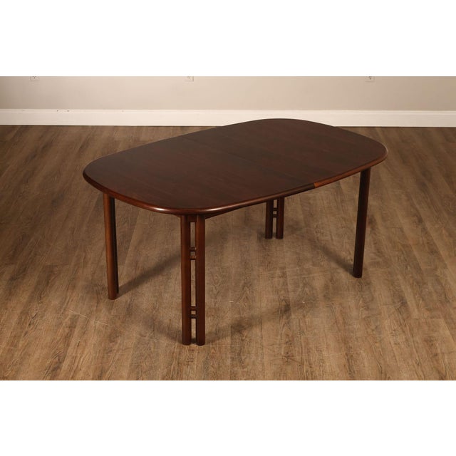 High Quality Modern Style Extension Dining Table Constructed From Rosewood. This Table Features An Oval Form Top With...