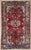 Antique hand-knotted rug from the Nahavand region in western Iran, featuring a dense, highly detailed field centered...