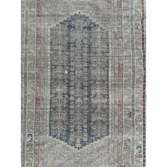 Exquisite distressed 18th-century Turkish Koula antique rug, meticulously handwoven with wool-on-wool craftsmanship. This...