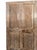 This vintage carved wood door features a beautifully distressed beige patina that exudes rustic farmhouse charm....
