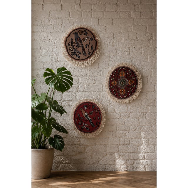 A matching set of three authentic vintage miniature rugs, hand-knotted in Tehran. The collection comprises two detailed...