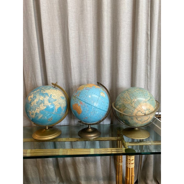 Set of three vintage 1960s metal base terrestial globes.