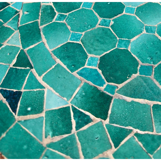 Add a pop of color and handcrafted charm to your home or patio with this beautiful teal mosaic accent table. Featuring a...
