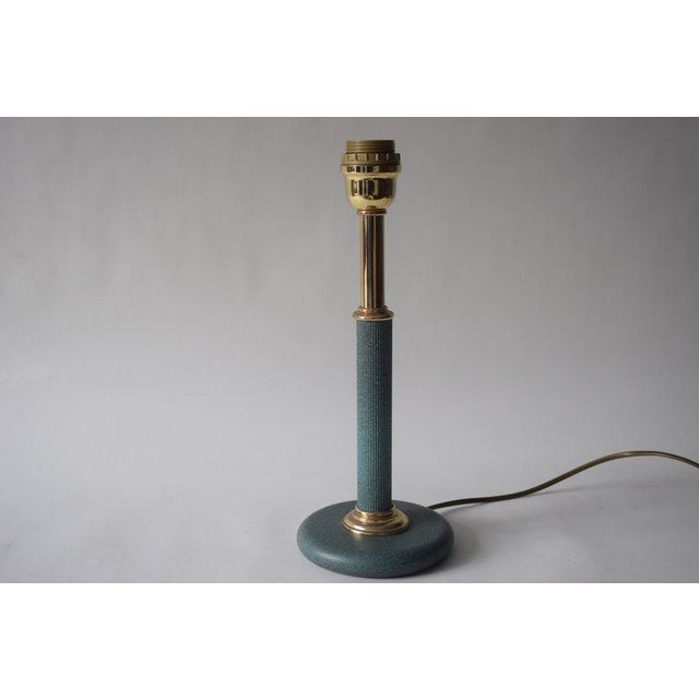 The 1980s gave the classic column lamp a wardrobe change. The form stayed traditional — a slender shaft on a round foot —...