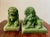 Excellent 1950s, premium-acrylic jade imperial guardian lions; also known as Shishi Lions. The male lion figure rests its...